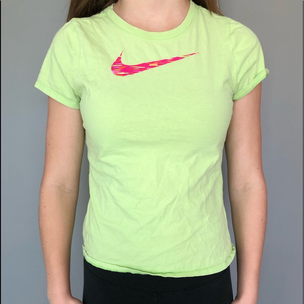 green nike shirt with pink and orange swoosh